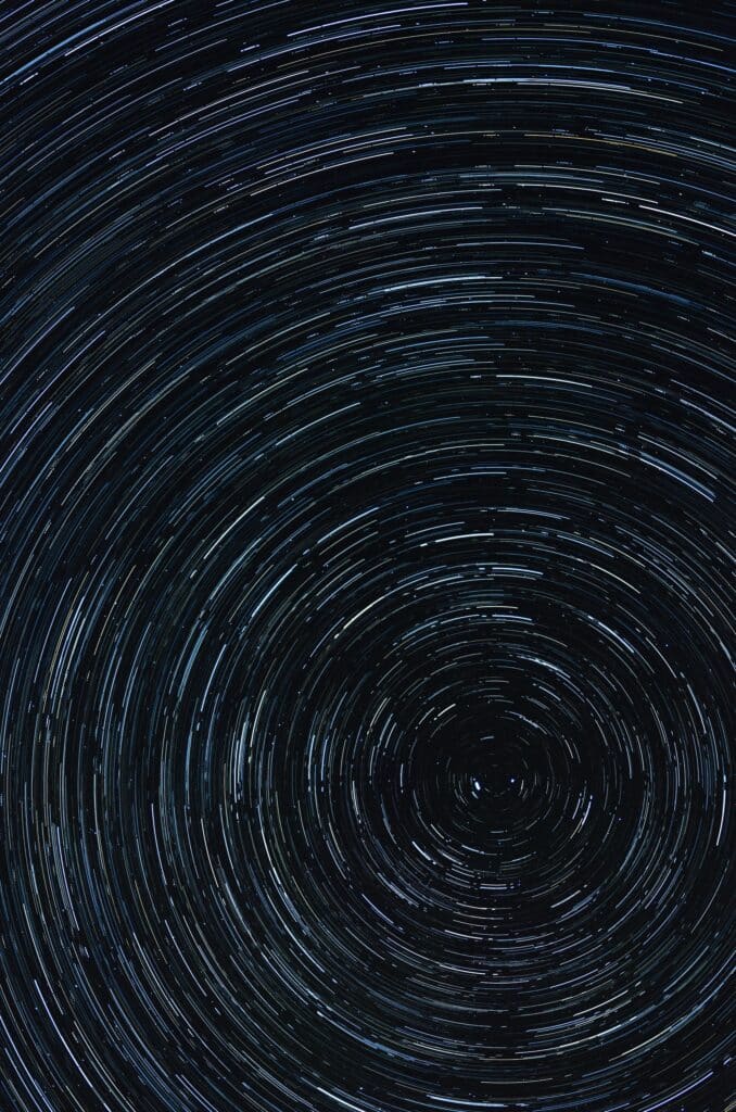 Star trails forming circular motion symbolizing raising your vibration and manifestation