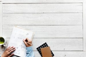 Writing goals in a journal for goal setting in manifestation practice