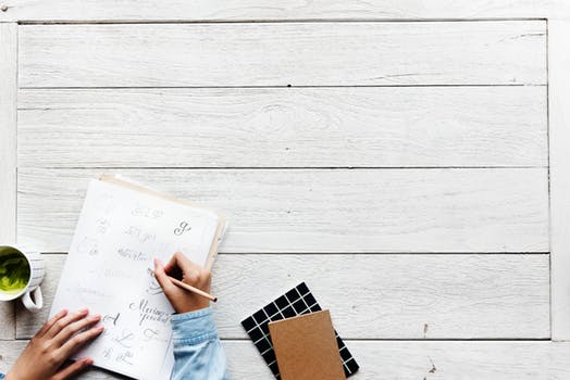 Writing goals in a journal for goal setting in manifestation practice