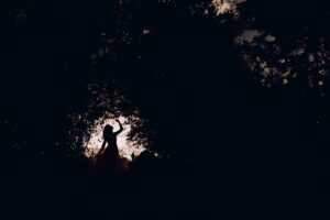 silhouette of woman in forest expressing feminine energy and intuitive movement