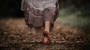 woman walking barefoot on the ground