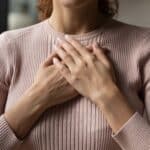 Hands over heart meditation showing how to start healing through self-connection