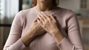 Hands over heart meditation showing how to start healing through self-connection
