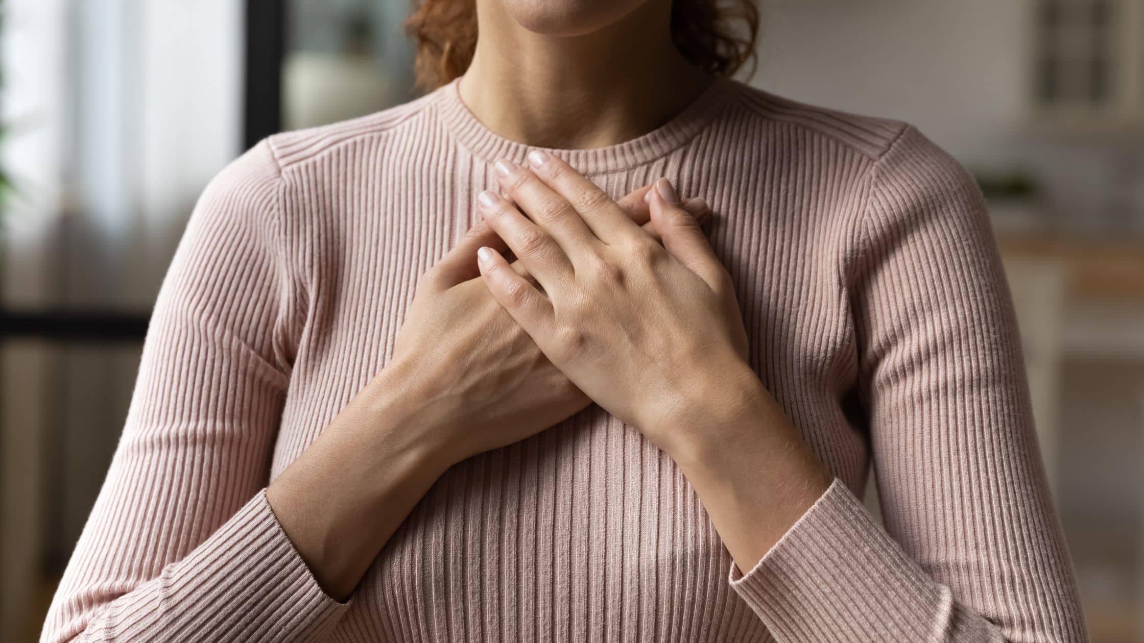 Hands over heart meditation showing how to start healing through self-connection