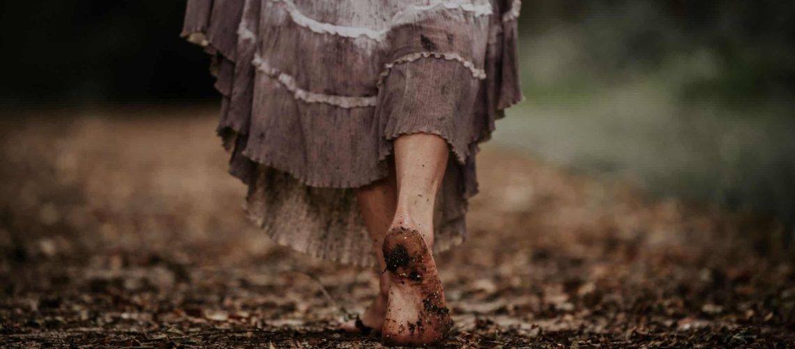 woman walking barefoot on the ground