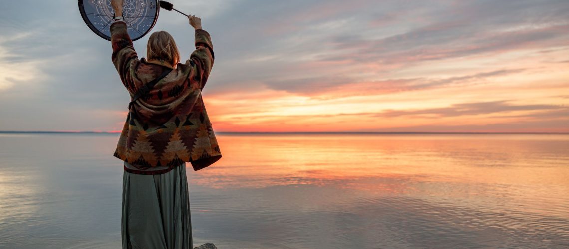 Woman dancing with shamanic drum Hero image for What is a shaman? Am I a shaman? How is Shamanic healing different from other modalities?